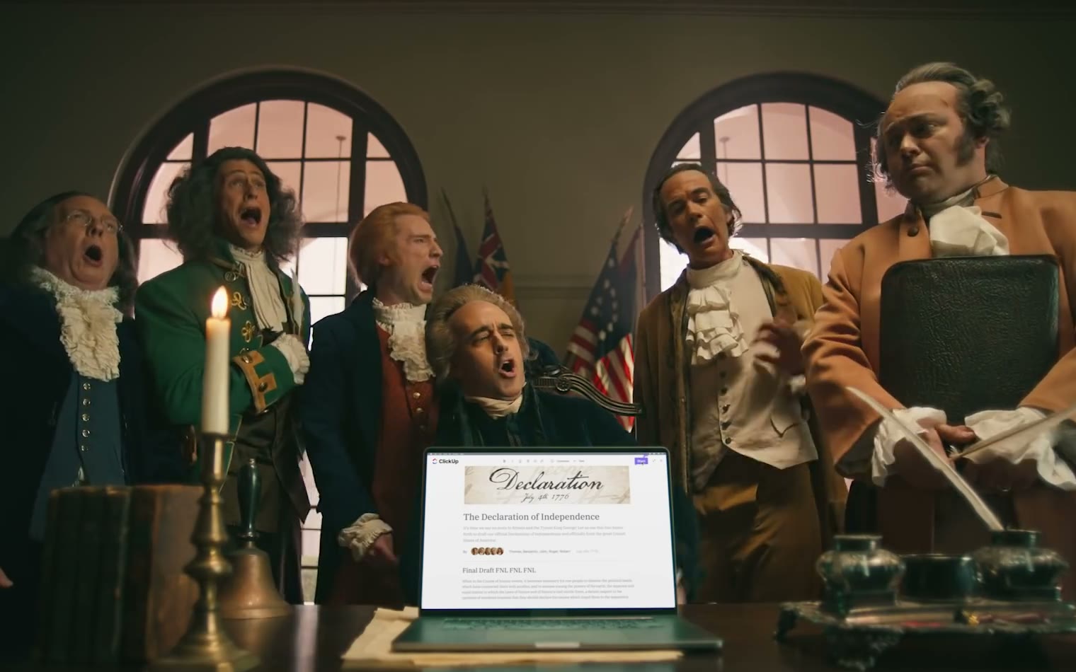 The founding fathers singing around a laptop in ClickUp's Declaration Super Bowl commercial